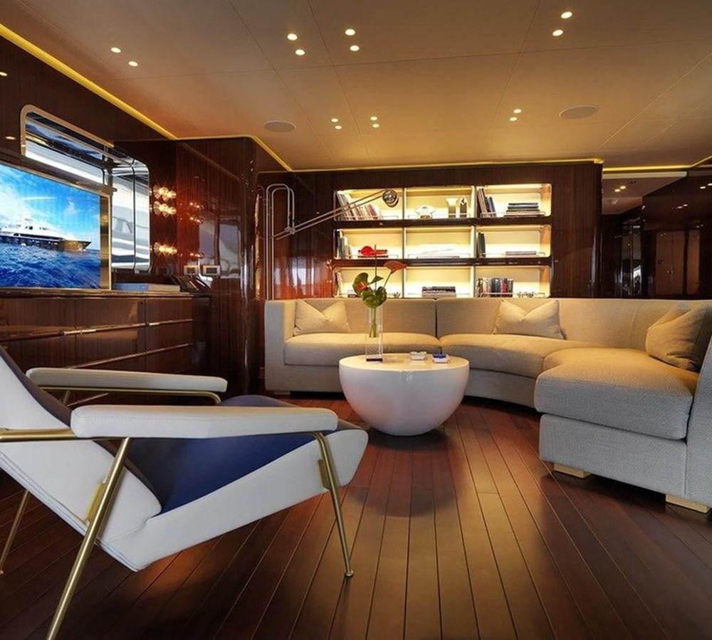 a living room with a wood floor aboard LADY IN BLUE Yacht for Sale