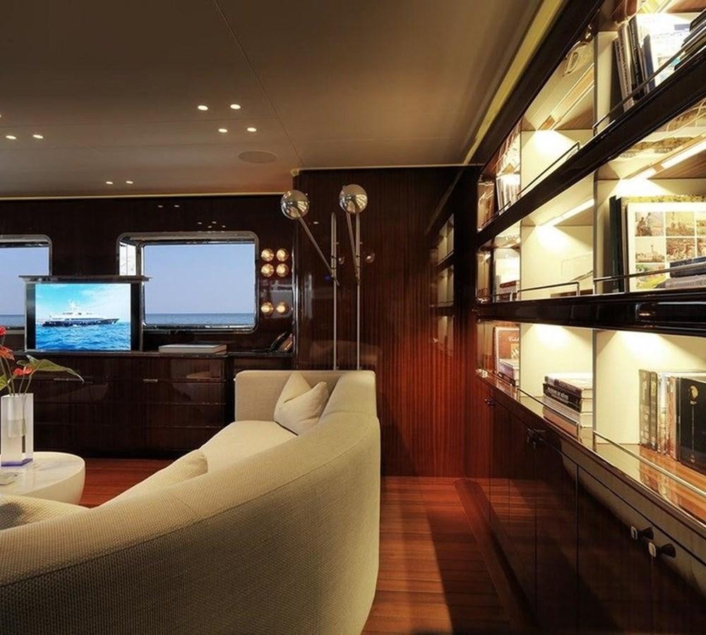 a room with a tv and couch aboard LADY IN BLUE Yacht for Sale