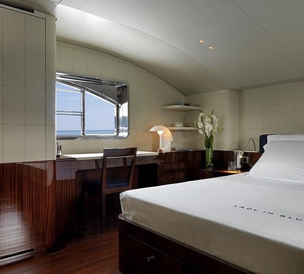 a room with a table and chairs aboard LADY IN BLUE Yacht for Sale