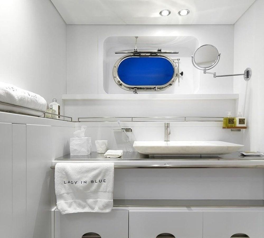 a white kitchen with a sink aboard LADY IN BLUE Yacht for Sale