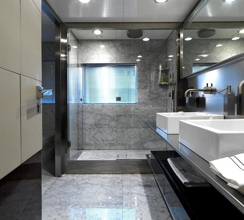 a bathroom with a glass shower aboard LADY IN BLUE Yacht for Sale