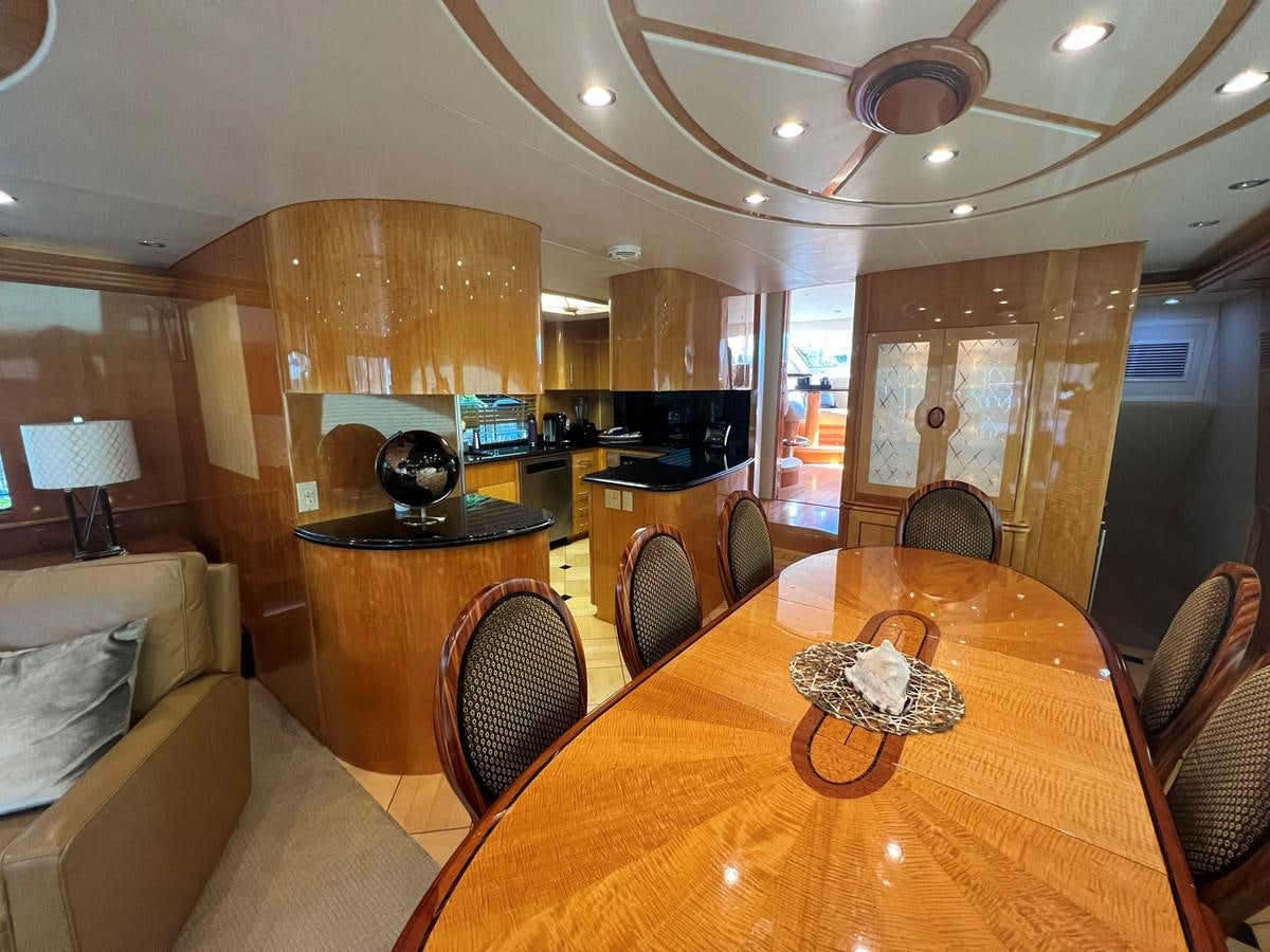 a large dining table in a living room aboard ARETECTE Yacht for Sale