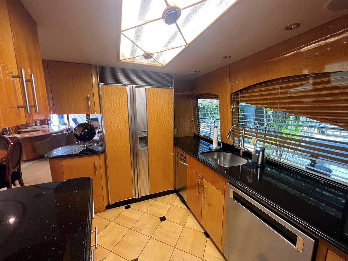 a kitchen with a large window aboard ARETECTE Yacht for Sale