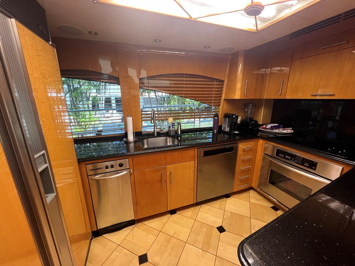 a kitchen with a window aboard ARETECTE Yacht for Sale