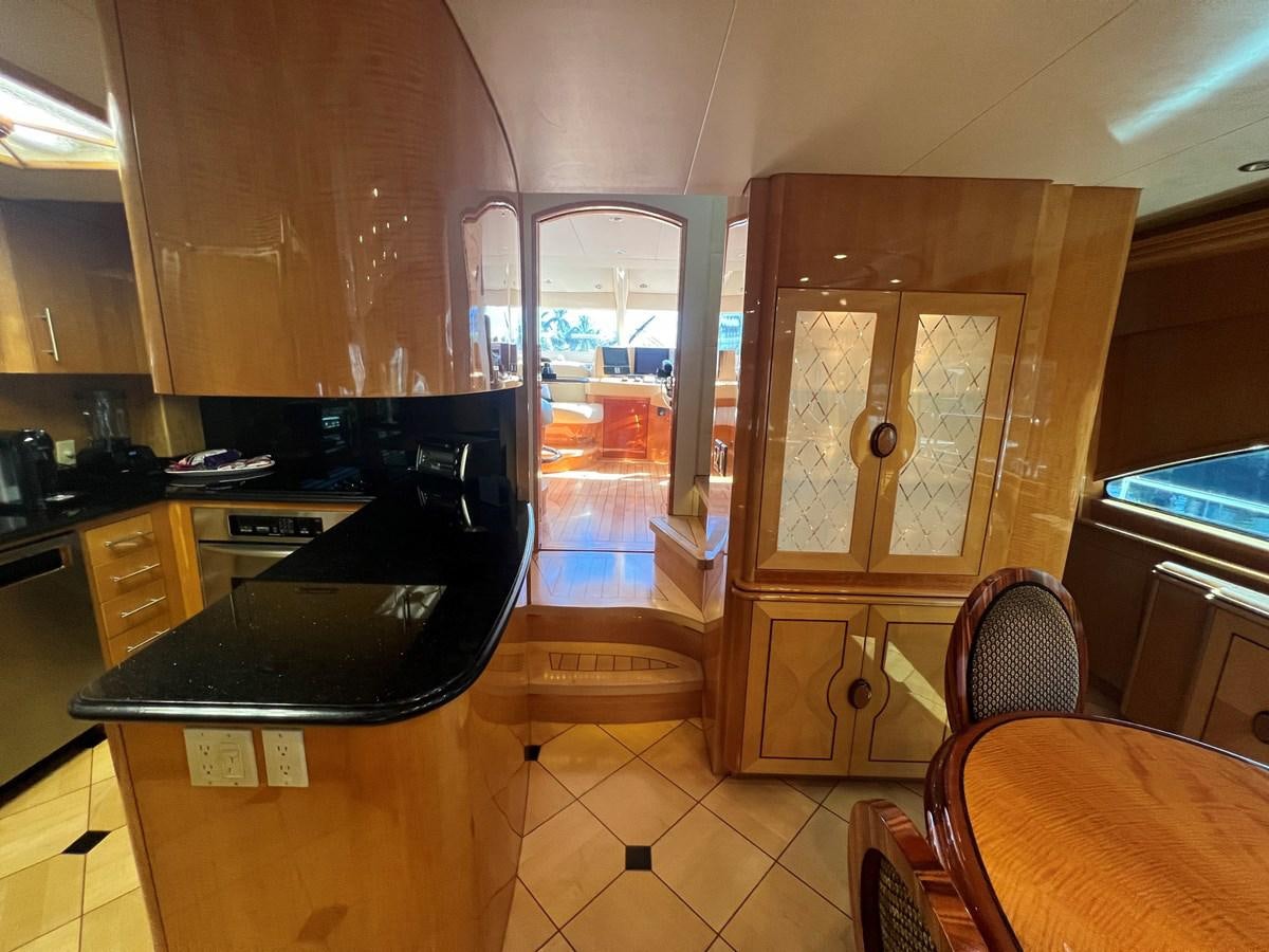 a kitchen with a black counter aboard ARETECTE Yacht for Sale