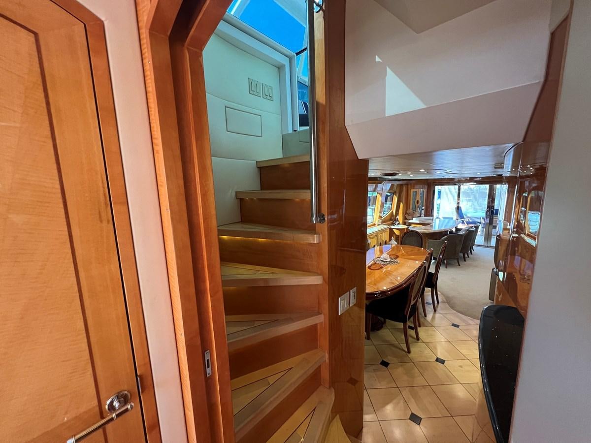 a wooden door leading to a dining room aboard ARETECTE Yacht for Sale