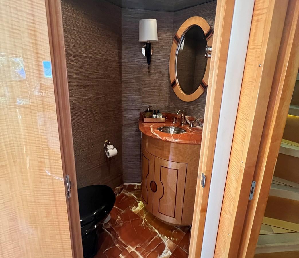 a bathroom with a sink and a mirror aboard ARETECTE Yacht for Sale