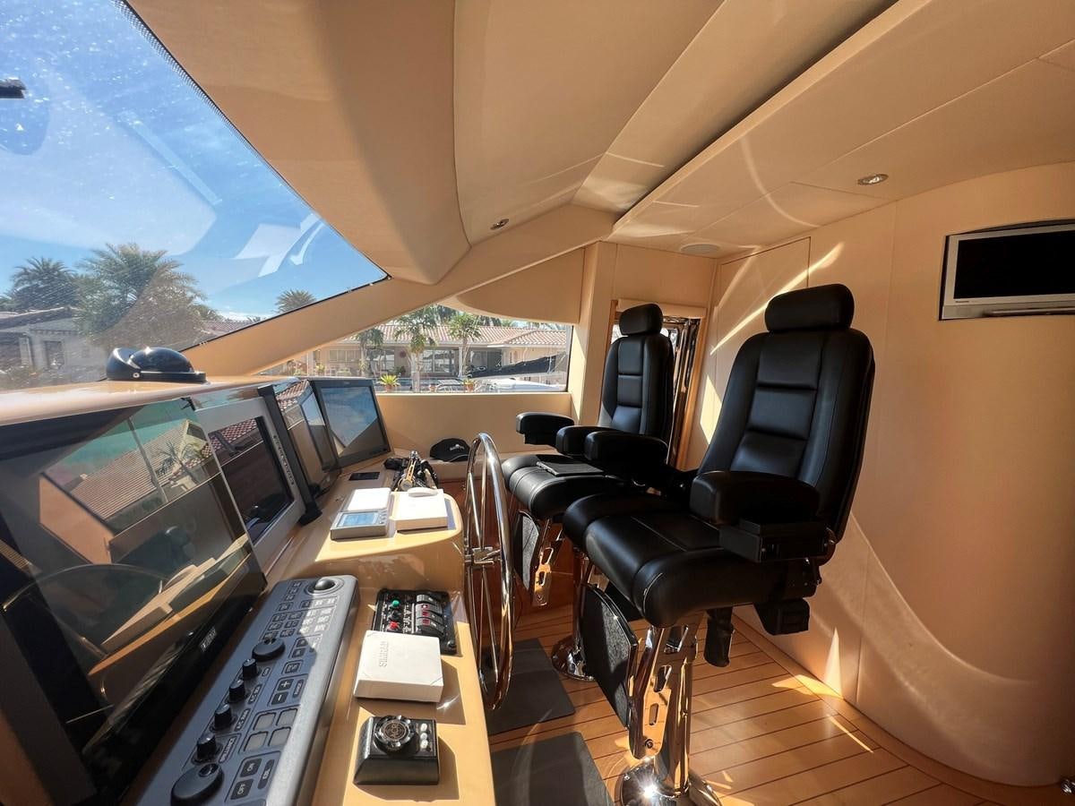 a room with computers and monitors aboard ARETECTE Yacht for Sale