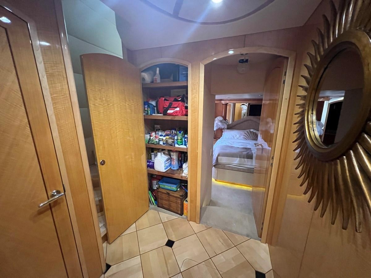 a person sitting in a chair in a room with a mirror aboard ARETECTE Yacht for Sale