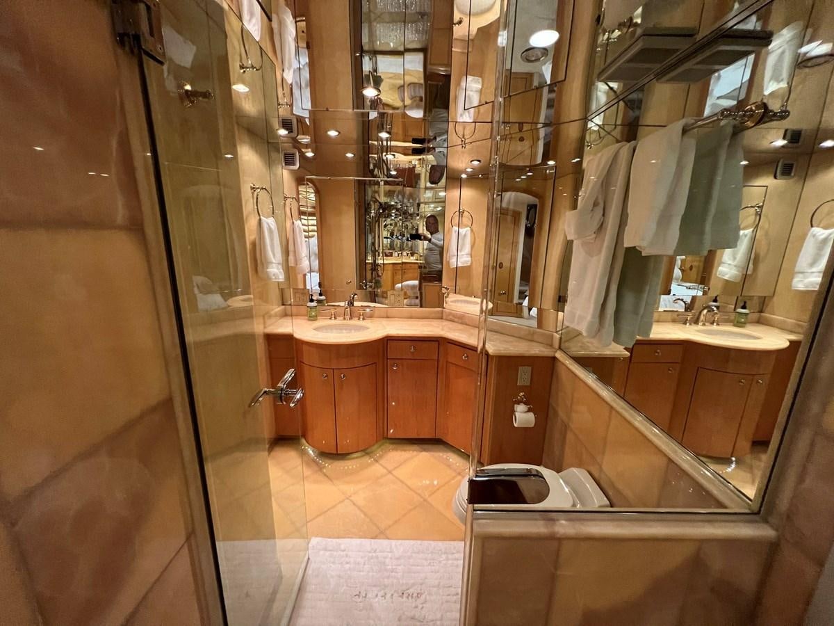 a bathroom with a large mirror aboard ARETECTE Yacht for Sale