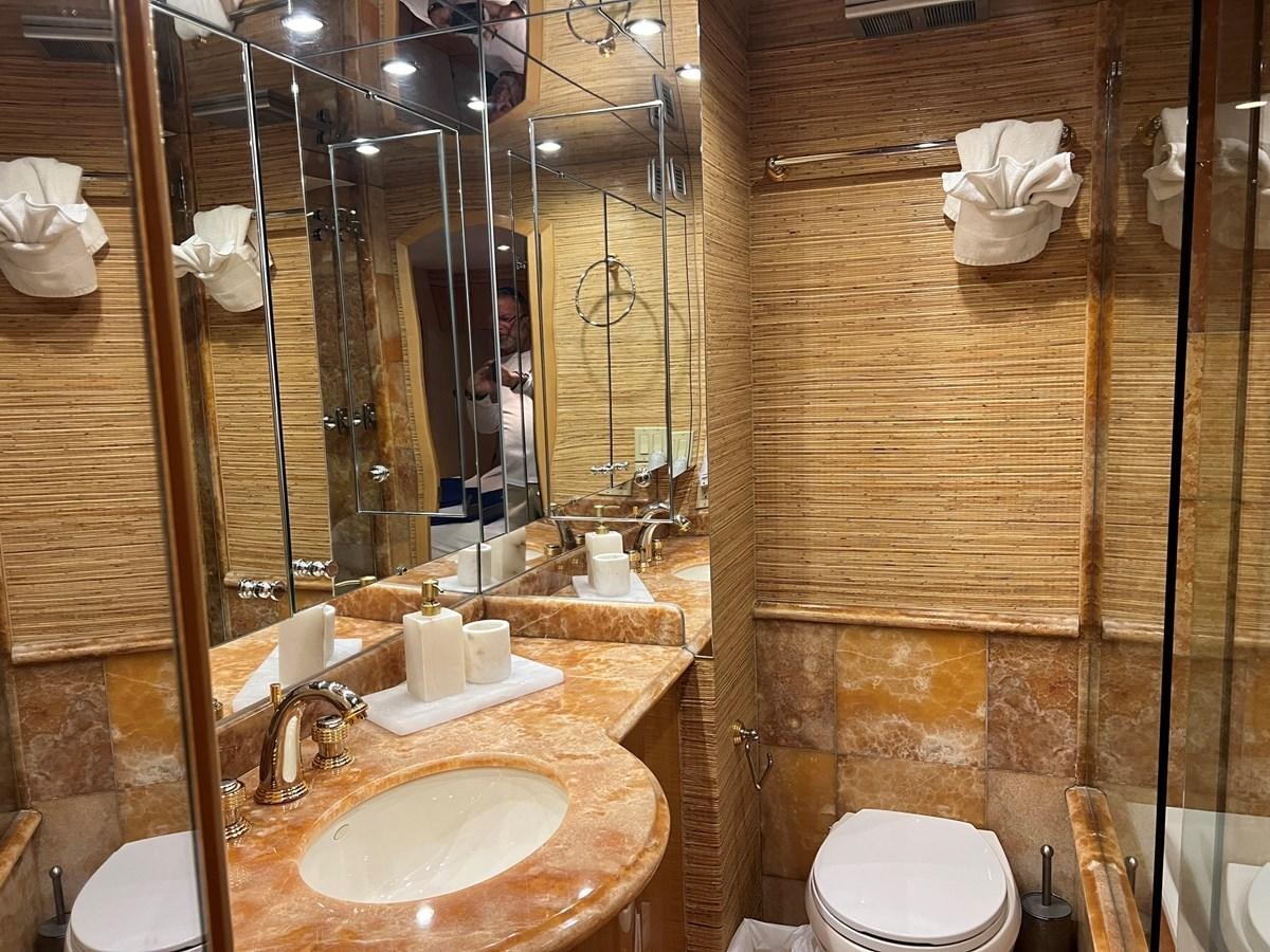 a bathroom with a glass shower aboard ARETECTE Yacht for Sale