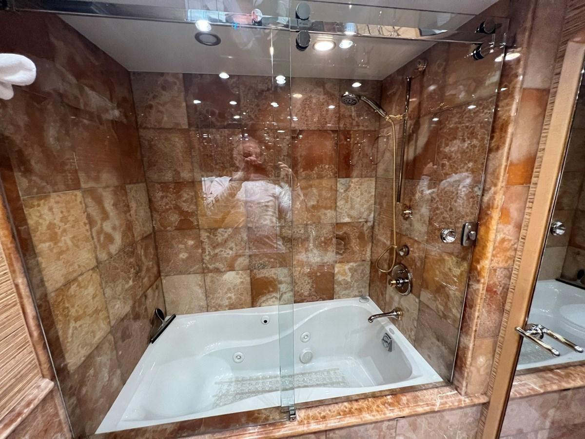 a bathroom with a bathtub aboard ARETECTE Yacht for Sale