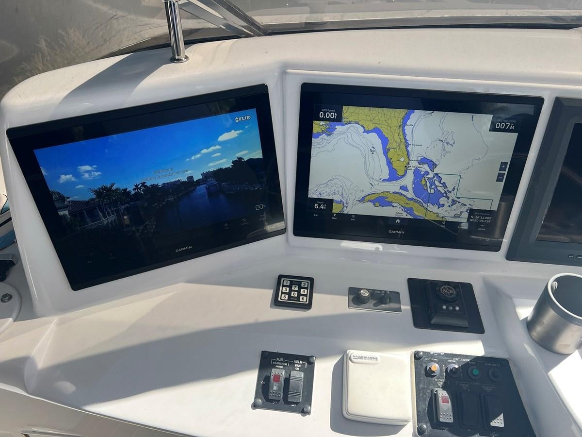 a couple of monitors on a car aboard ARETECTE Yacht for Sale