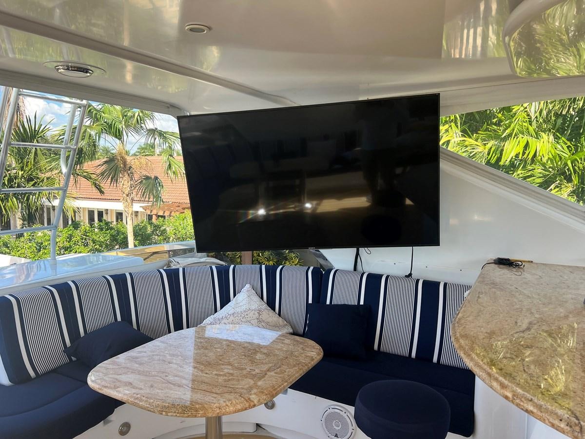 a room with a table and chairs aboard ARETECTE Yacht for Sale