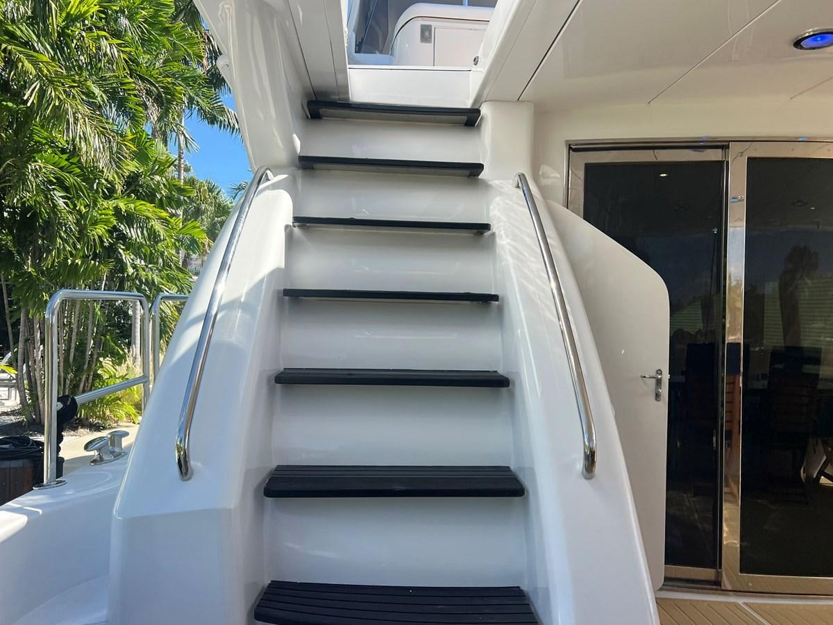 a white staircase with a railing aboard ARETECTE Yacht for Sale
