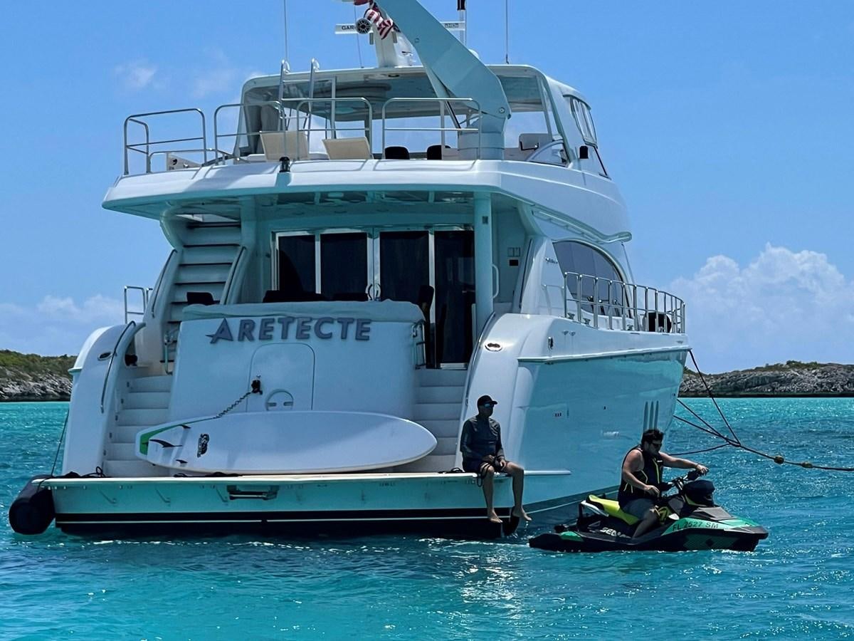 a boat with a couple people in it aboard ARETECTE Yacht for Sale