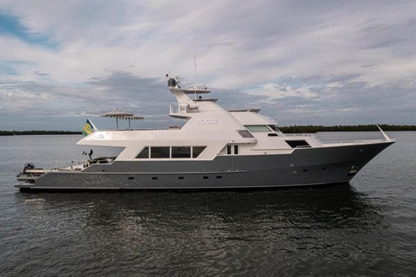 a white yacht in the water aboard ROGUE Yacht for Sale