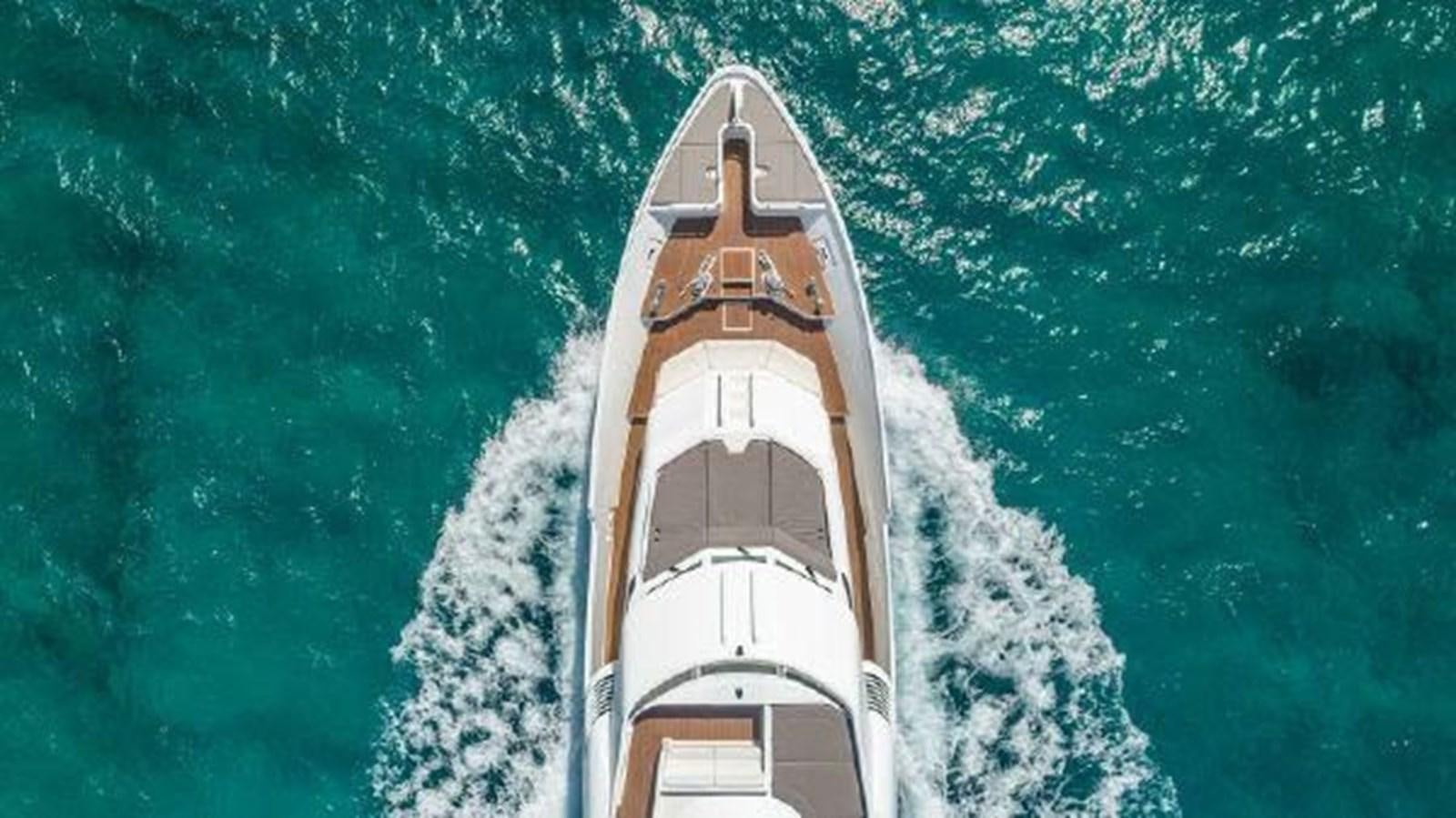 a tall building with trees around it aboard ROGUE Yacht for Sale