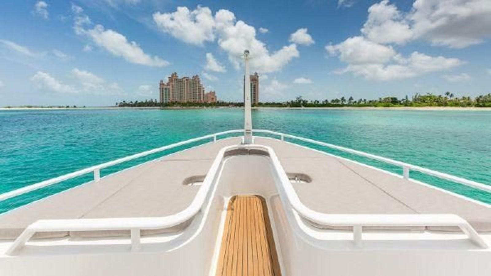 a long white bridge over water aboard ROGUE Yacht for Sale