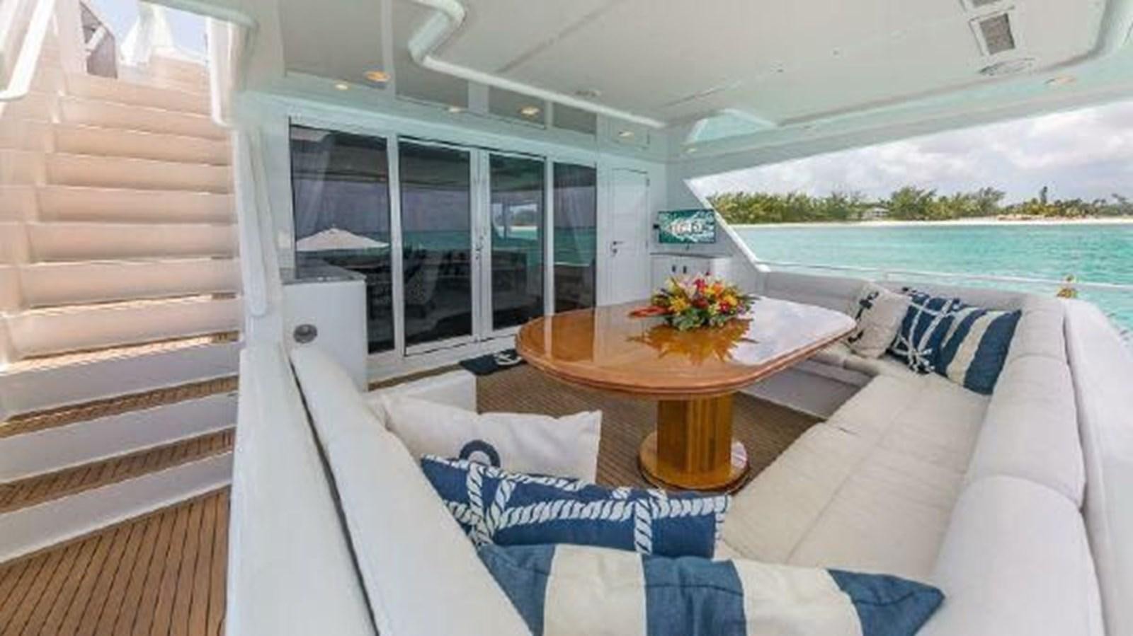 a living room with a couch and a table aboard ROGUE Yacht for Sale
