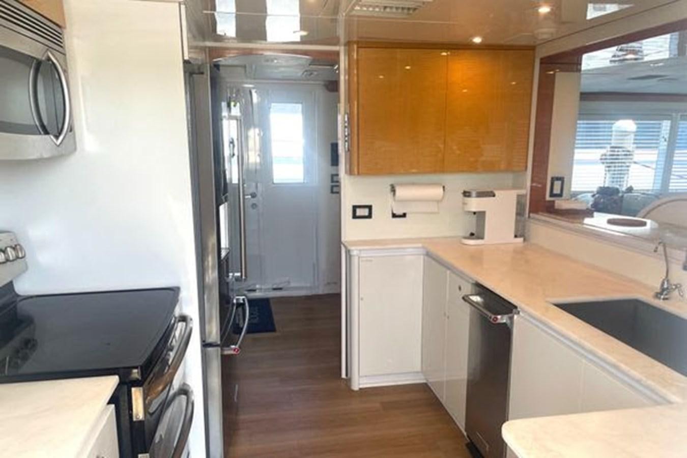 a kitchen with a sink and a stove aboard ROGUE Yacht for Sale