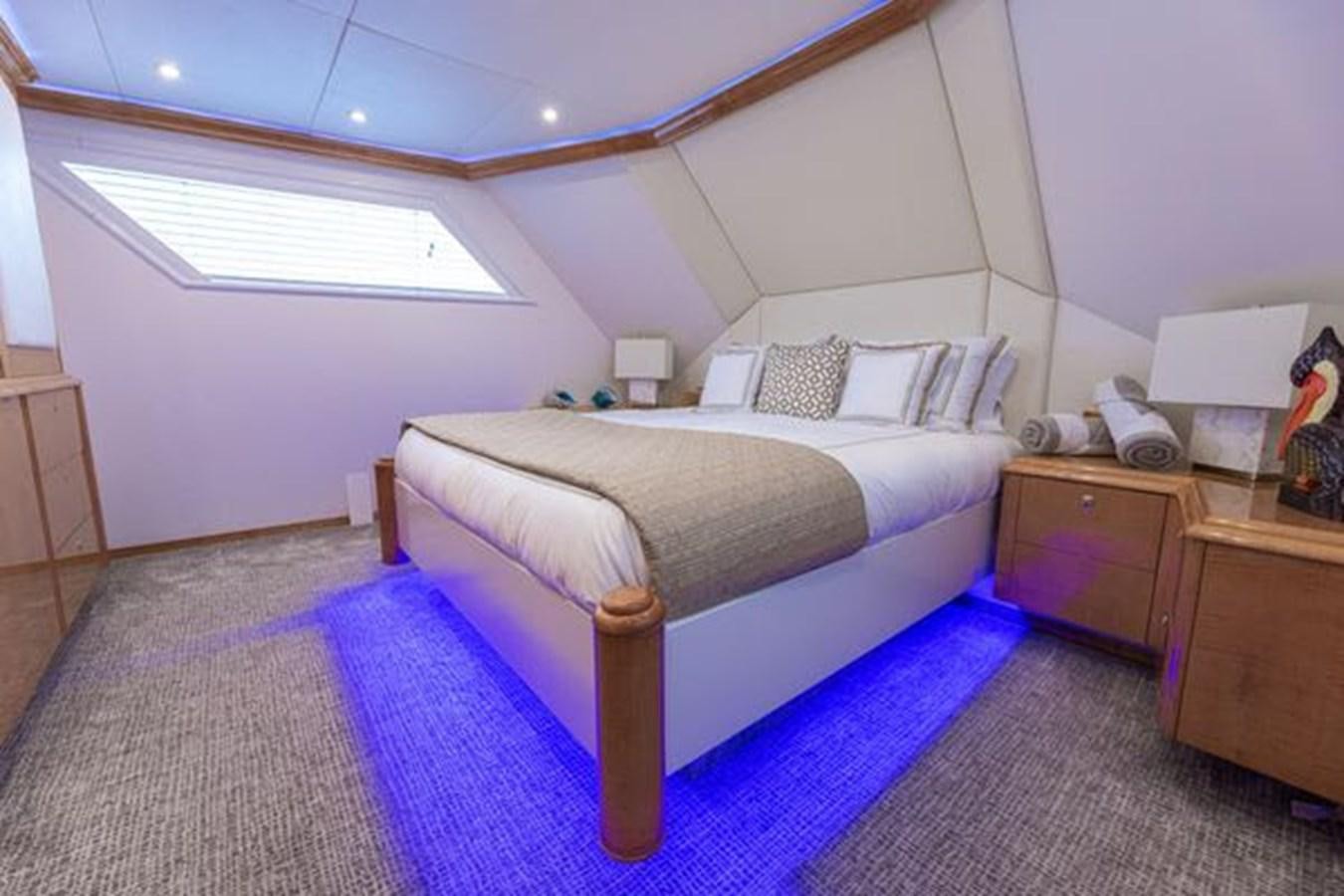 a bed in a room aboard ROGUE Yacht for Sale