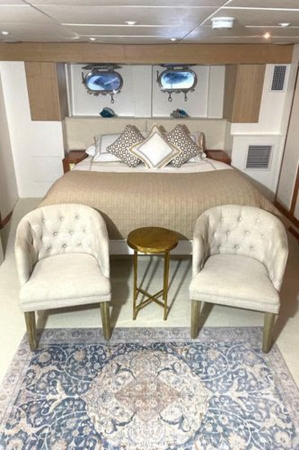 a room with chairs and a table aboard ROGUE Yacht for Sale