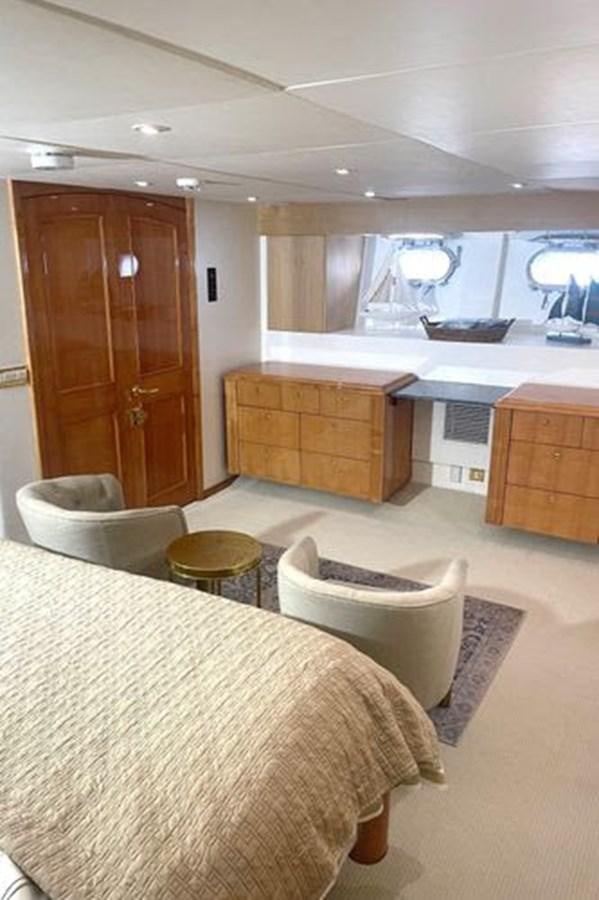a kitchen with a table and chairs aboard ROGUE Yacht for Sale