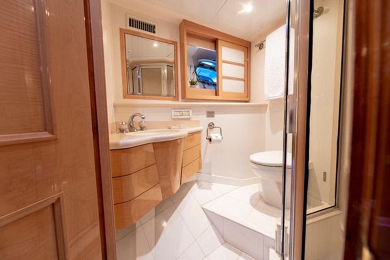 a bathroom with a toilet and a sink aboard ROGUE Yacht for Sale