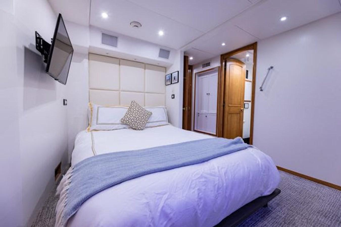 a bed in a room aboard ROGUE Yacht for Sale