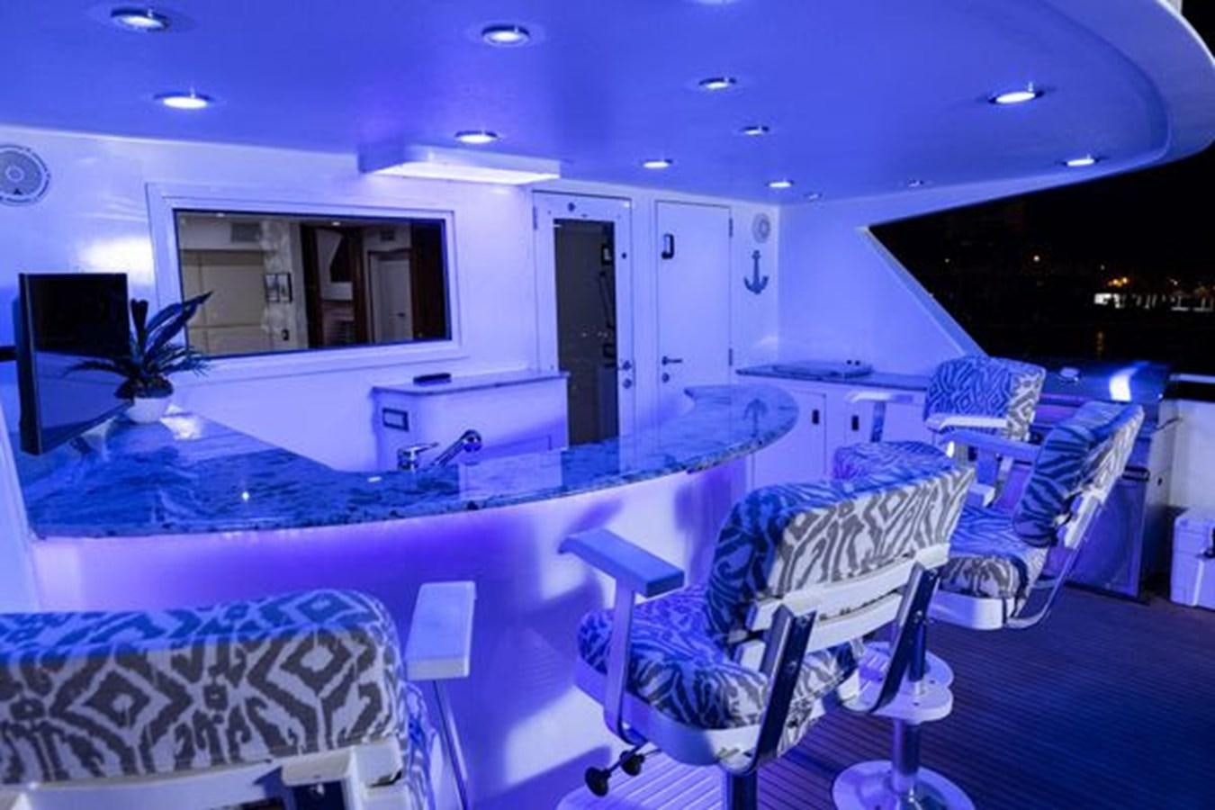 a large kitchen with a large marble counter top aboard ROGUE Yacht for Sale