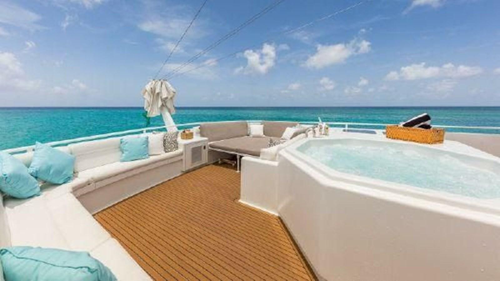 a pool with a deck and a view of the ocean aboard ROGUE Yacht for Sale