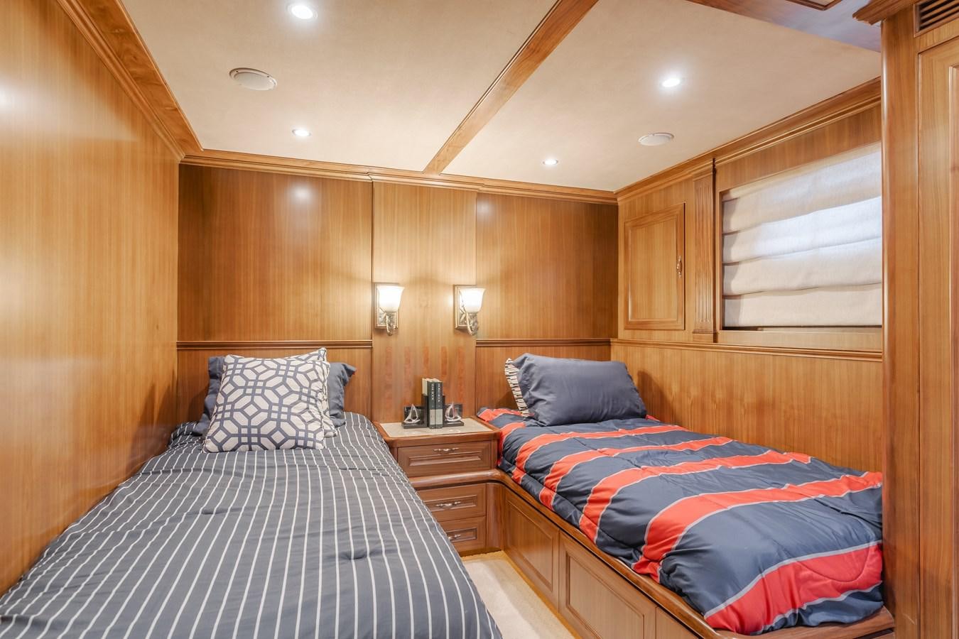 a couple of beds in a wooden room aboard HARLEY G Yacht for Sale