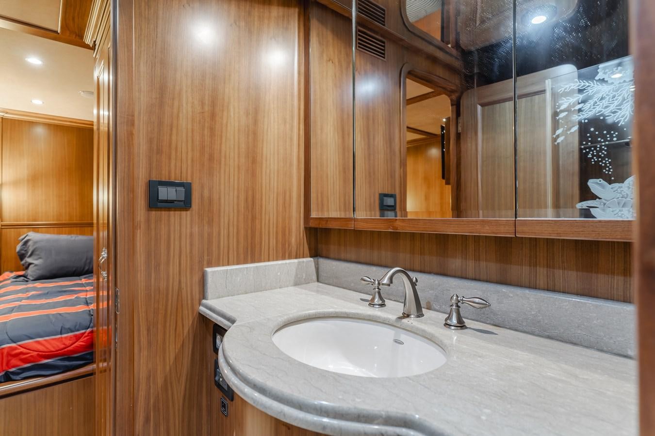 a bathroom with a sink and a mirror aboard HARLEY G Yacht for Sale
