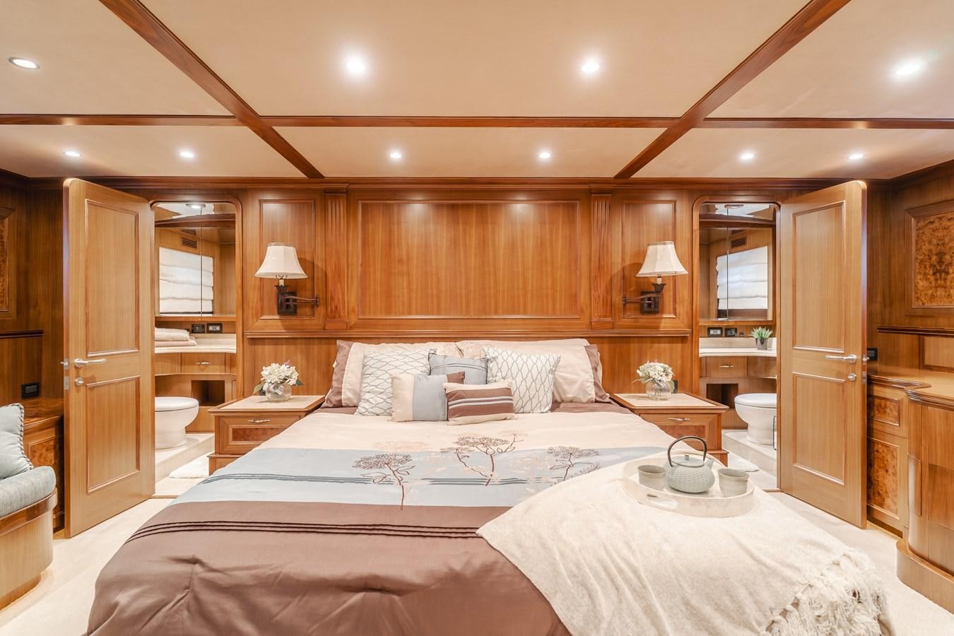 a room with a bed and a mirror aboard HARLEY G Yacht for Sale