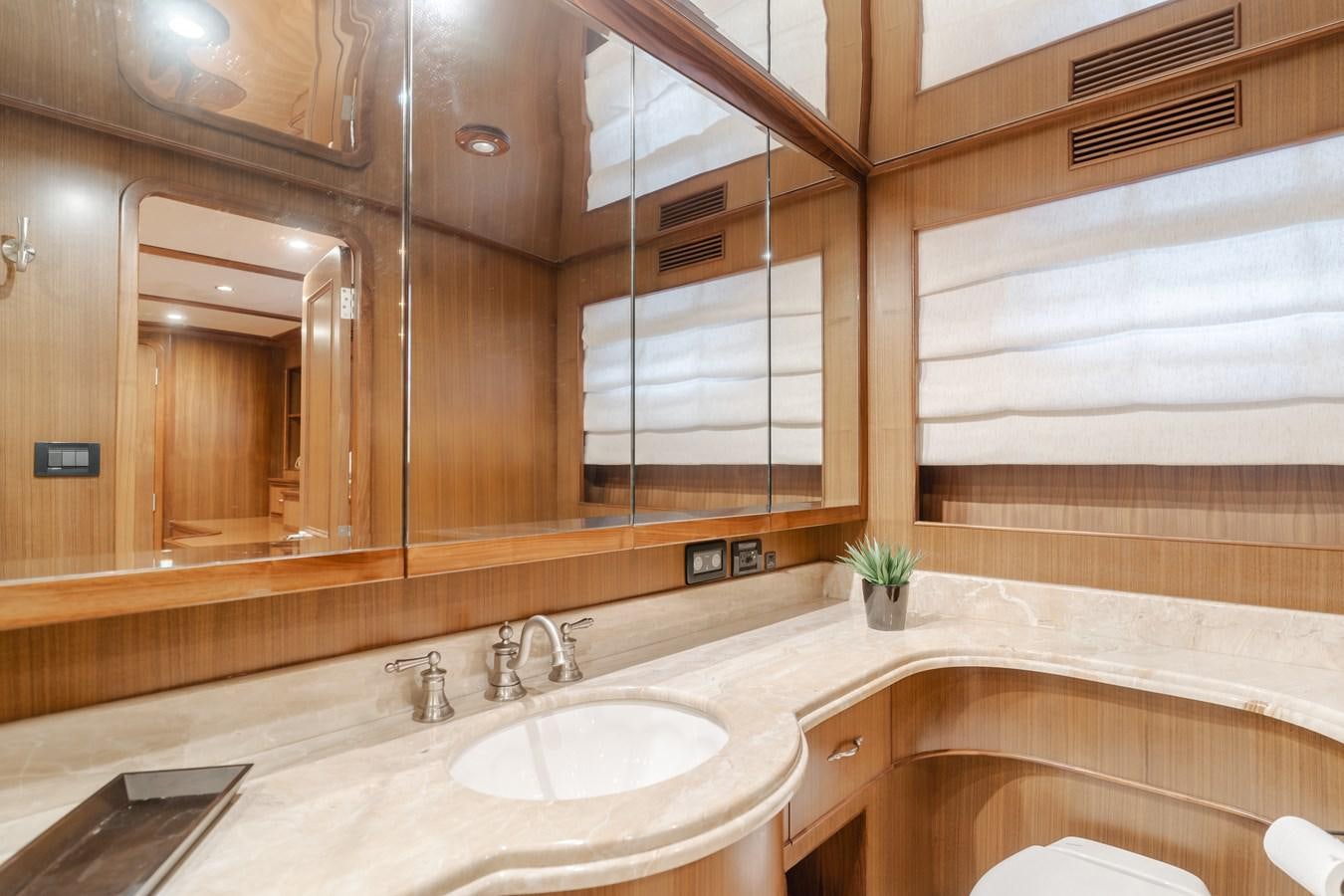 a bathroom with a large mirror aboard HARLEY G Yacht for Sale