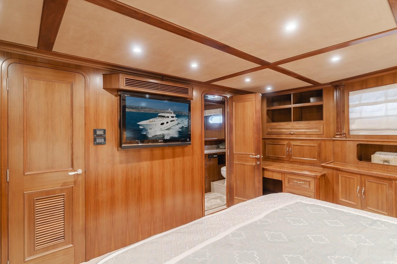 a bedroom with a large bed aboard HARLEY G Yacht for Sale