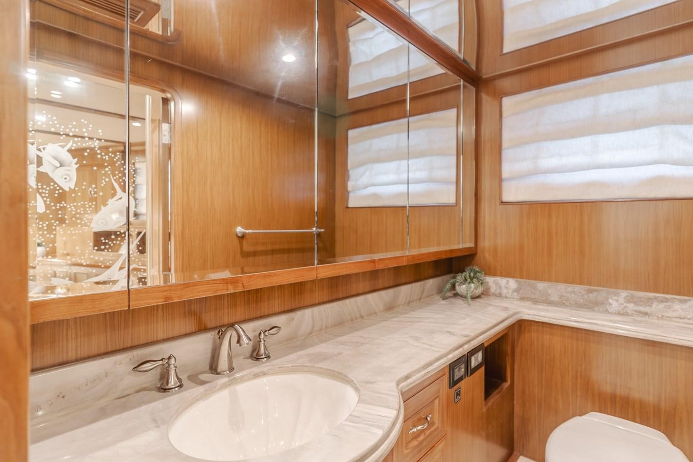 a bathroom with a sink and a mirror aboard HARLEY G Yacht for Sale