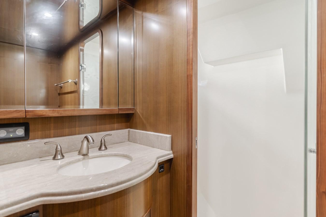 a bathroom with a sink and a mirror aboard HARLEY G Yacht for Sale