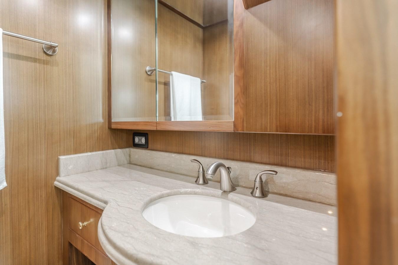 a bathroom with a sink and a mirror aboard HARLEY G Yacht for Sale