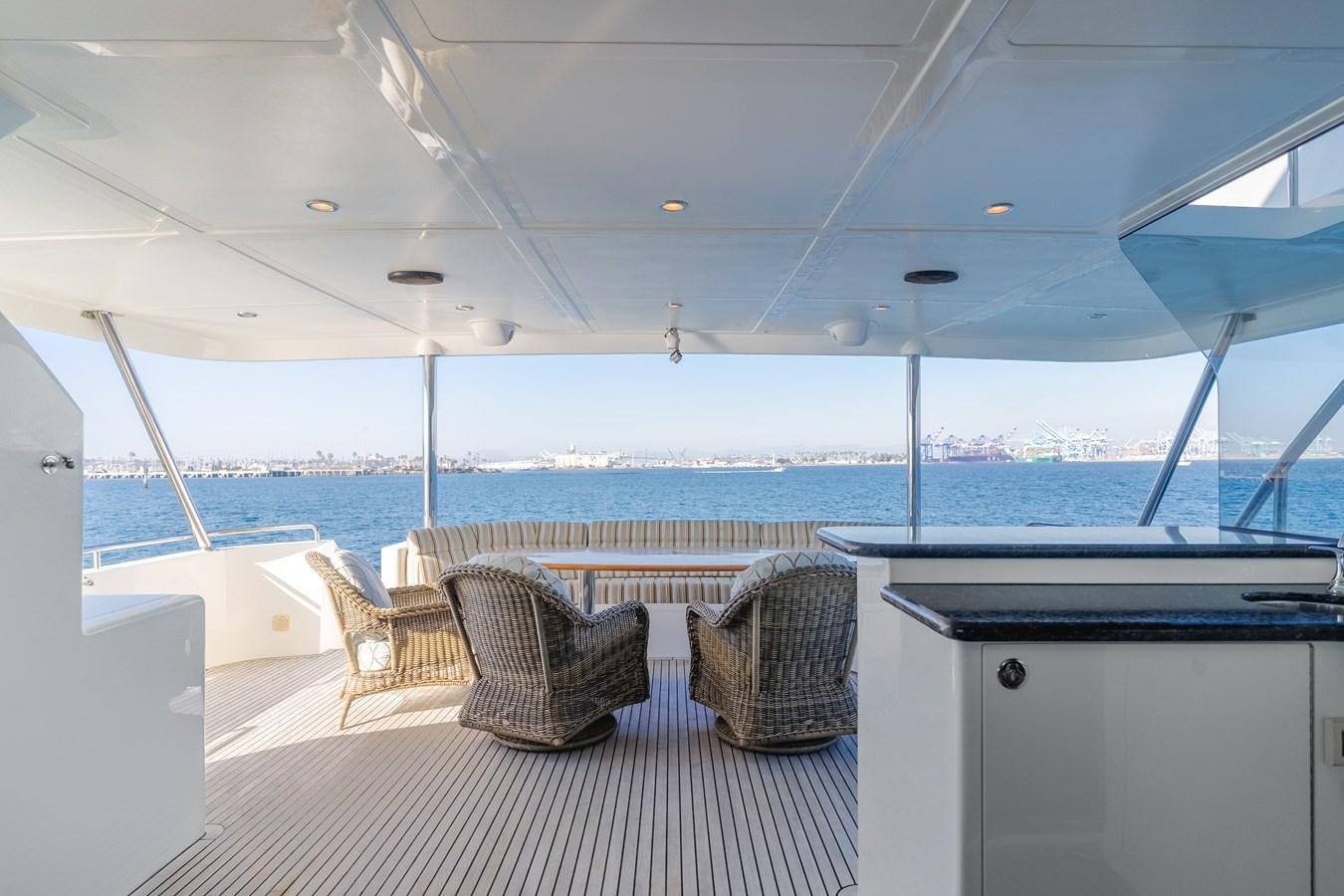 a room with chairs and a table aboard HARLEY G Yacht for Sale