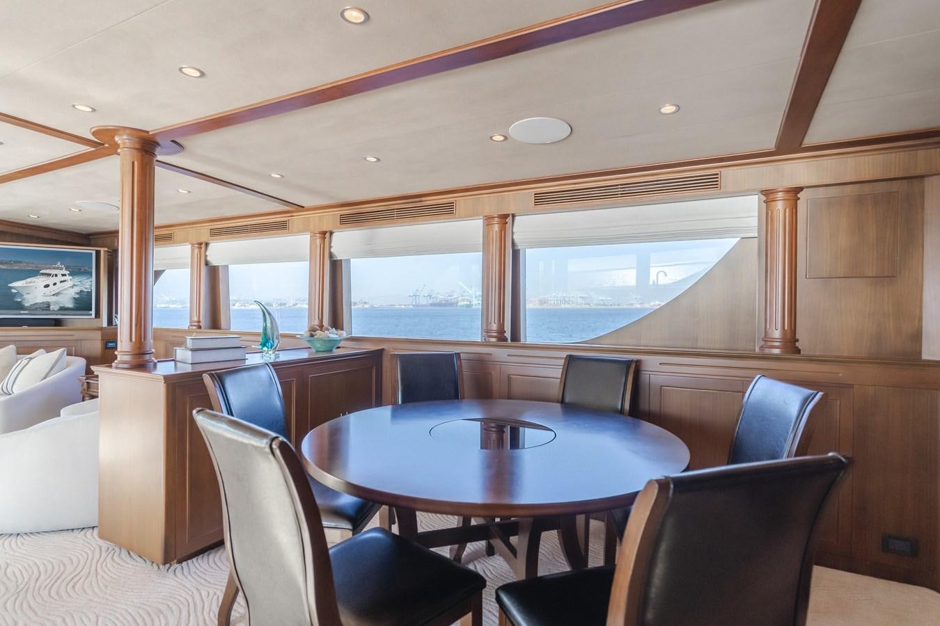 a room with a table and chairs aboard HARLEY G Yacht for Sale