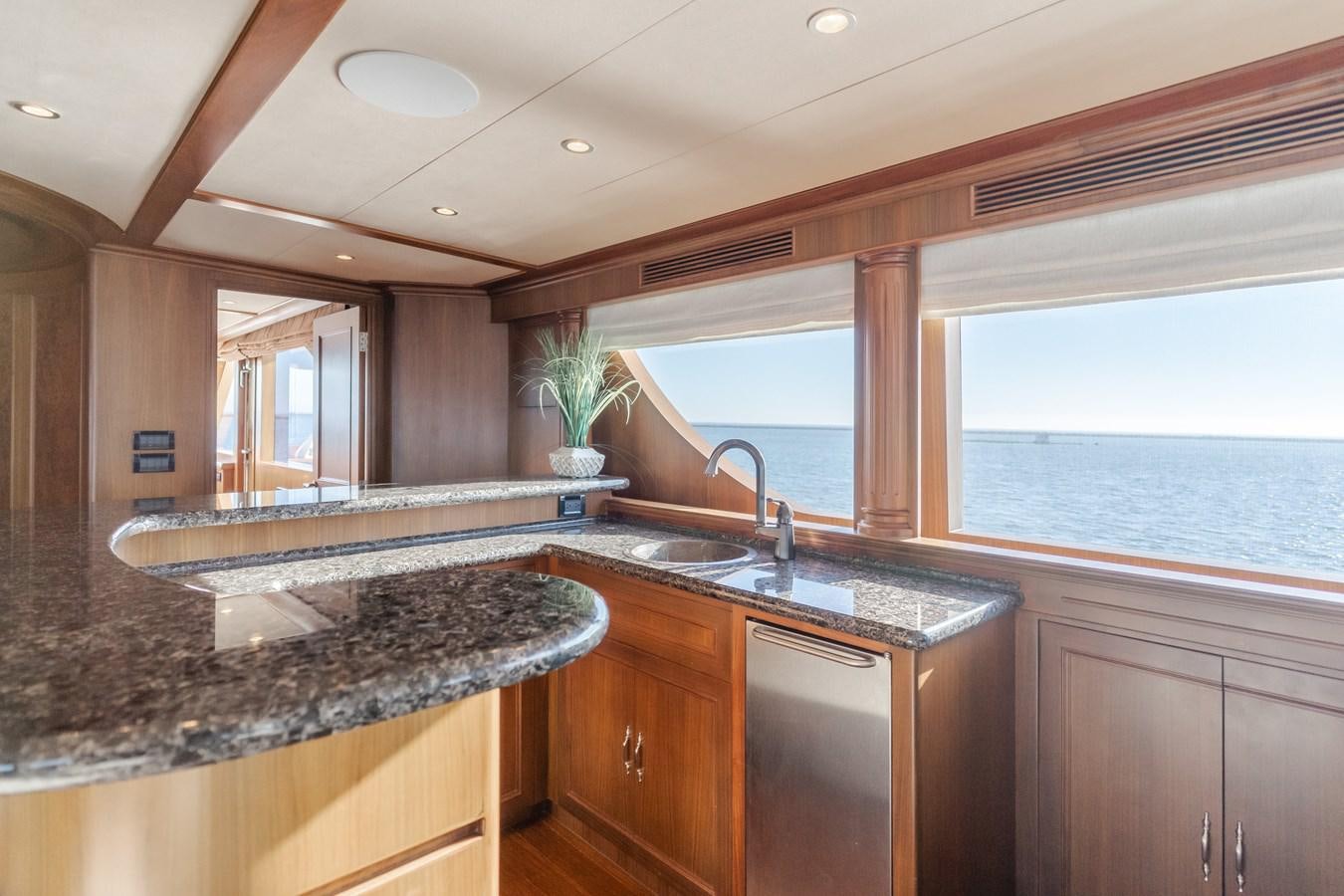 a kitchen with a large window aboard HARLEY G Yacht for Sale