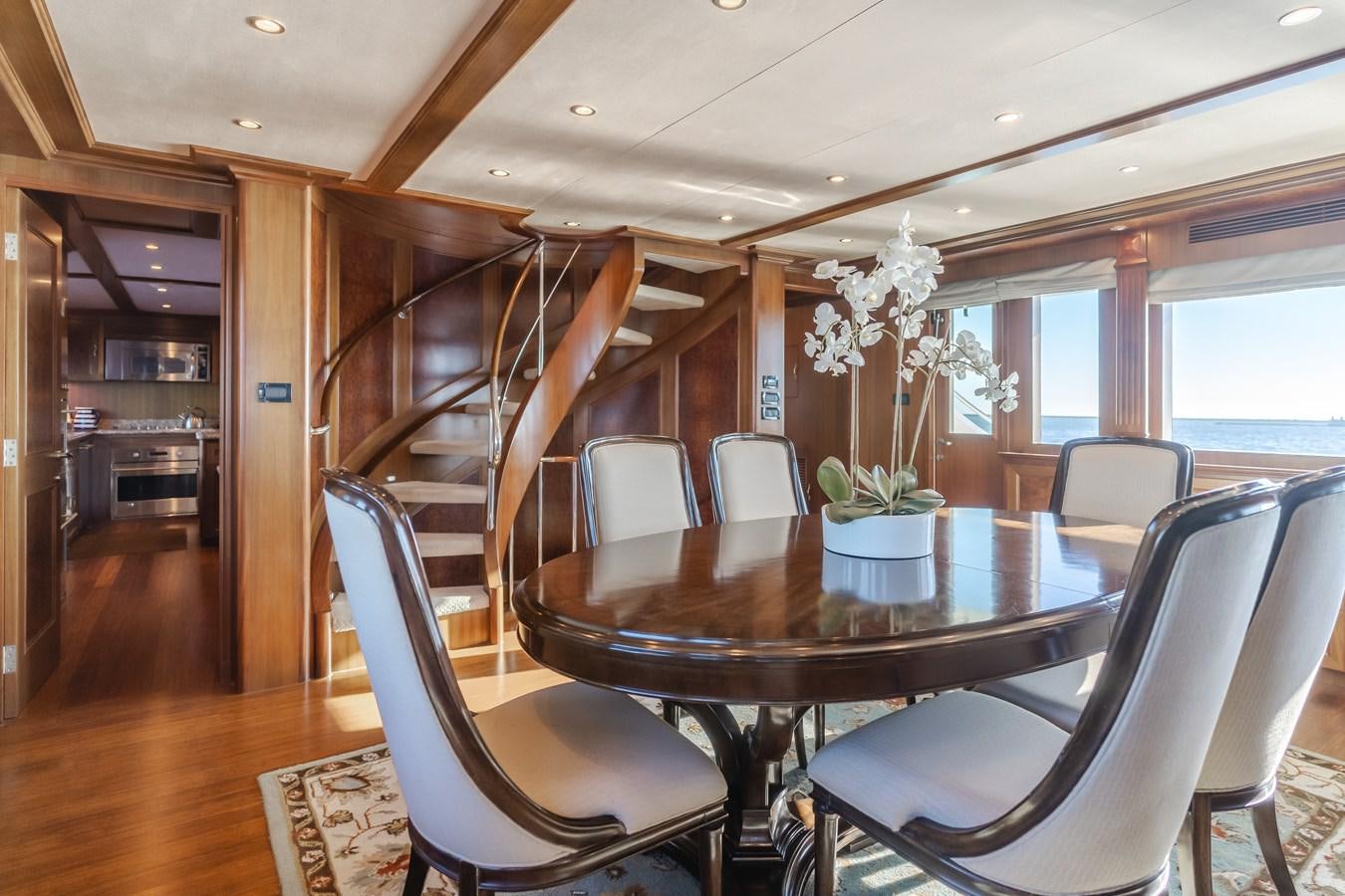 a dining room with a table and chairs aboard HARLEY G Yacht for Sale