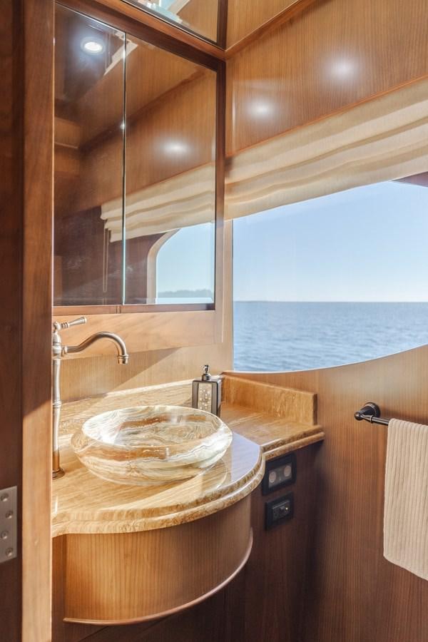 a kitchen with a sink and a view of the ocean aboard HARLEY G Yacht for Sale