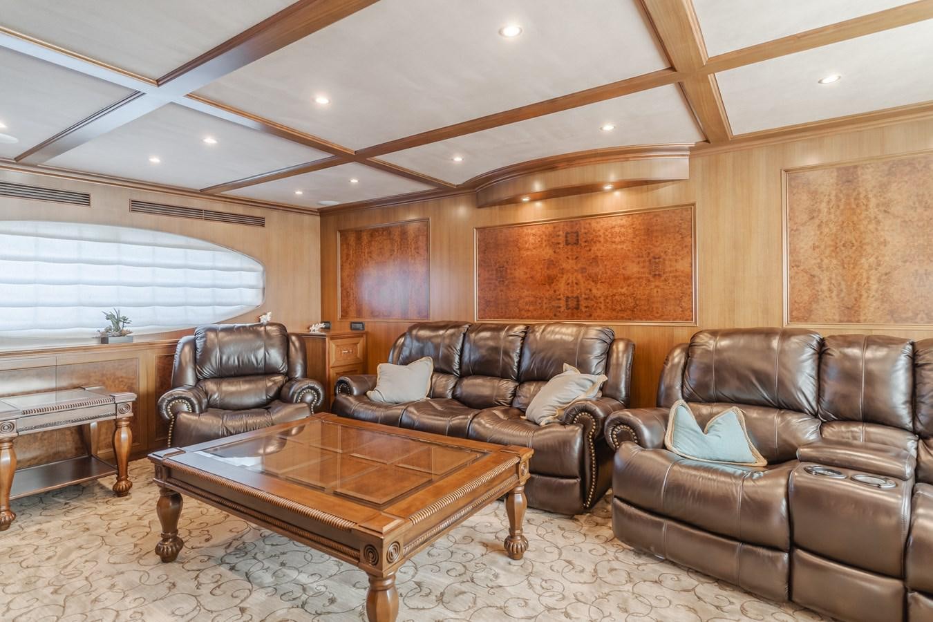 a living room with leather couches aboard HARLEY G Yacht for Sale