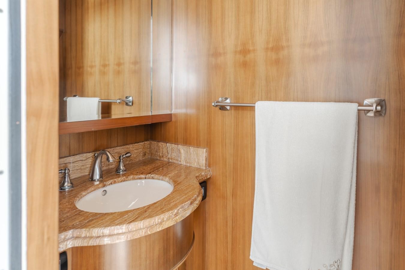 a bathroom with a sink and towels aboard HARLEY G Yacht for Sale