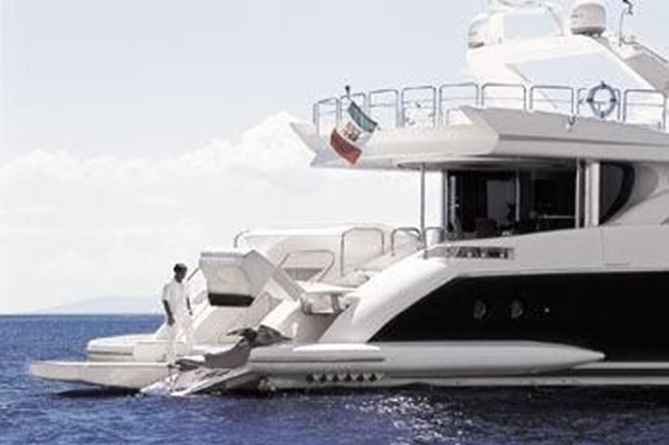 a couple of people standing on a boat in the water aboard 2004 AZIMUT 98 LEONARDO Yacht for Sale