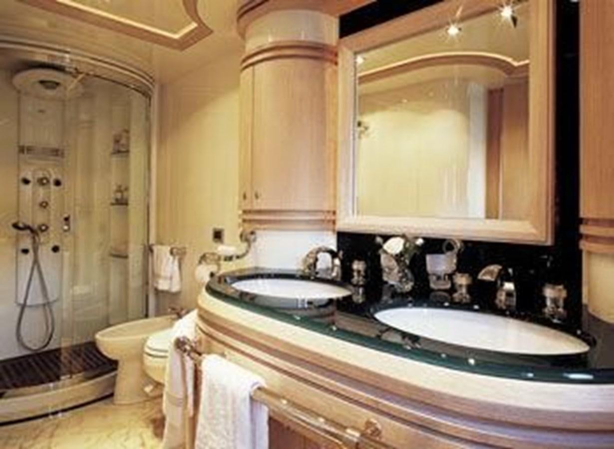 a bathroom with a sink and a mirror aboard 2004 AZIMUT 98 LEONARDO Yacht for Sale