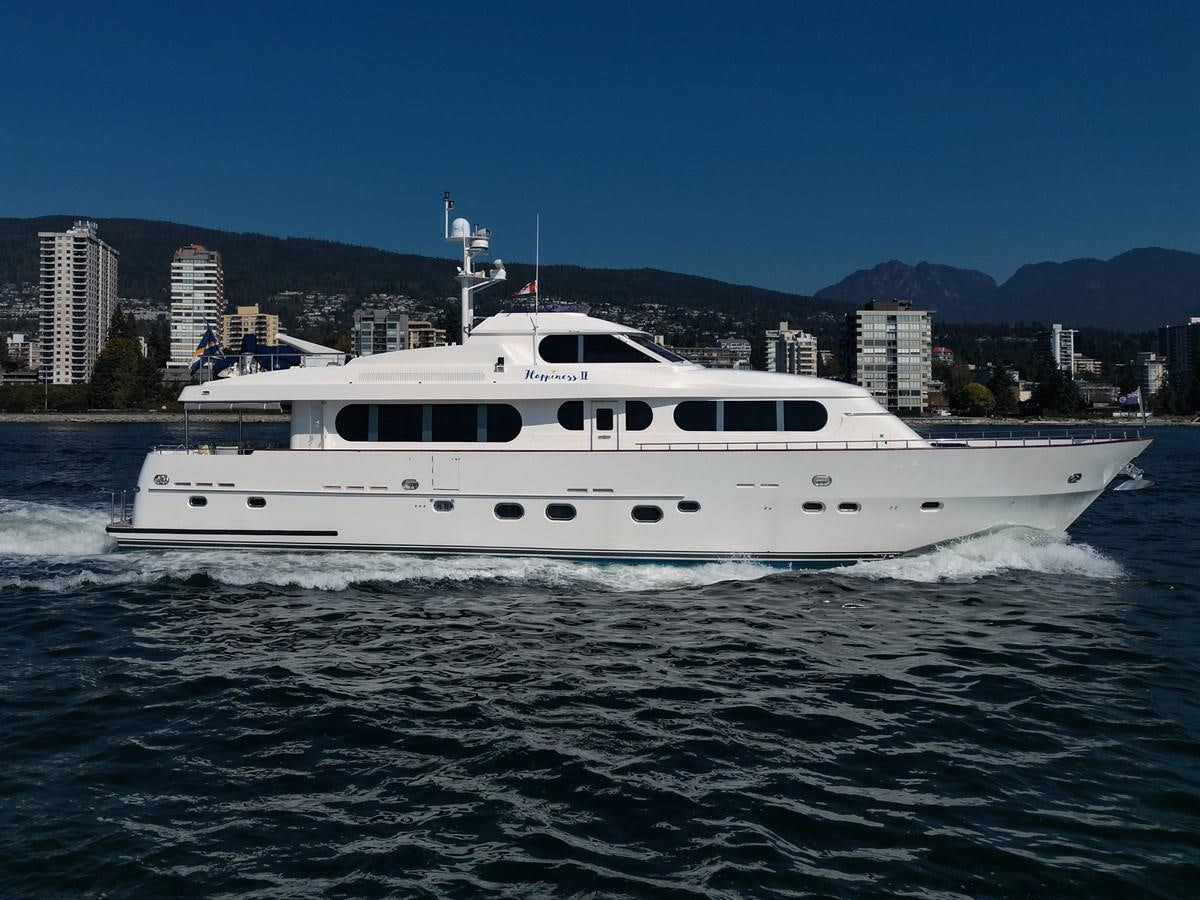 a white boat on water aboard HAPPINESS II Yacht for Sale